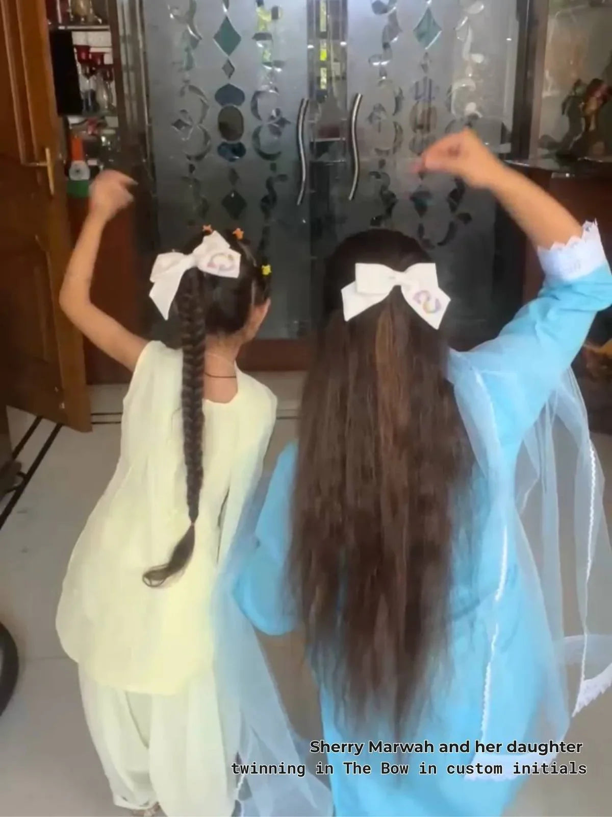 Sherry Mariah mua influencer and her daughter twinning in the bow with their custom initial hand embroidered letter