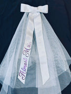 Bridal veil bow on black background with customised text- almost mrs