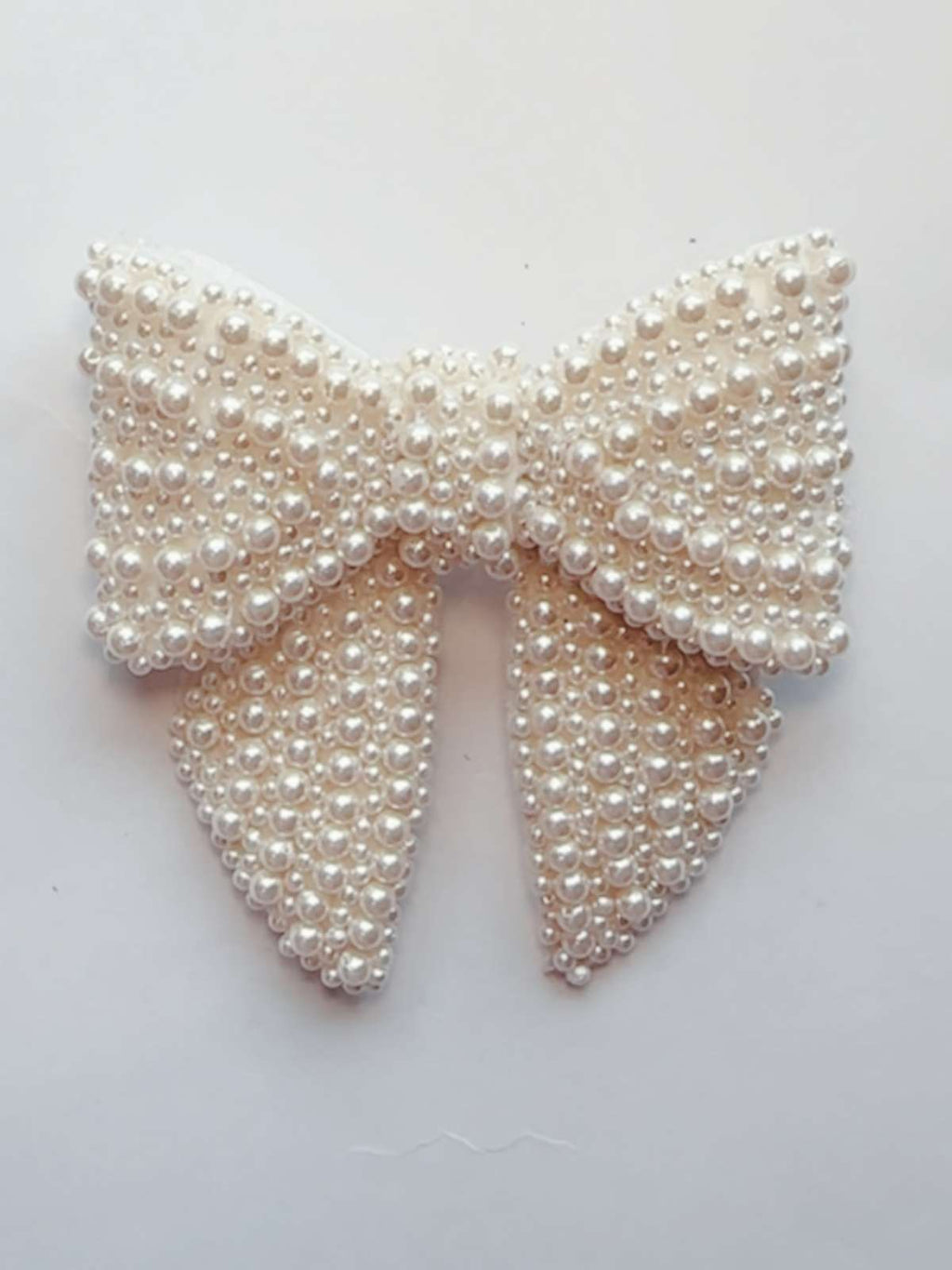 Pearl bow on a white background