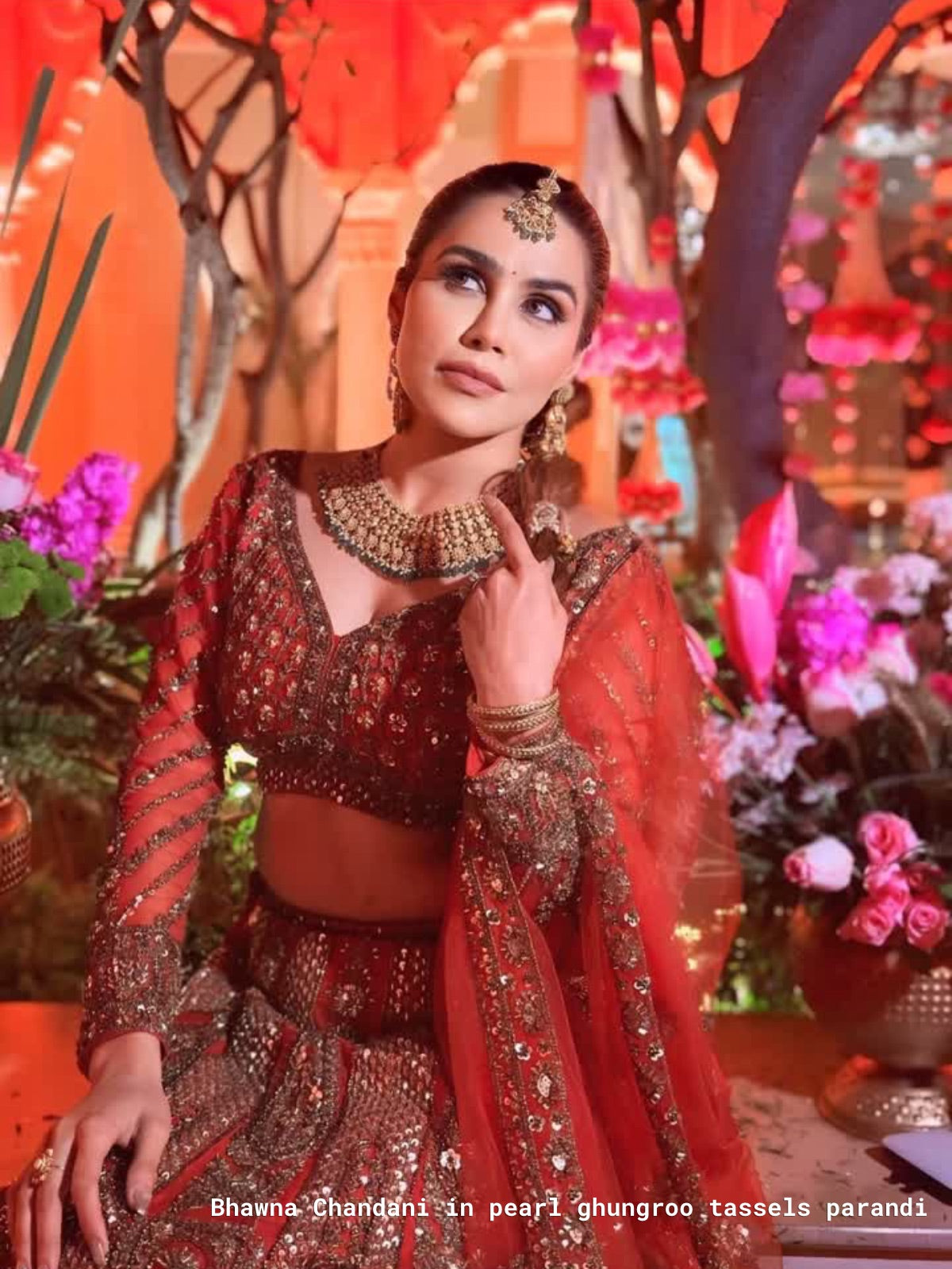 Bhawna chandani in traditional red and gold outfit wearing loveknots earl ghungroo tassesls parandi