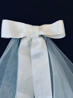 White satin bow on bridal veil