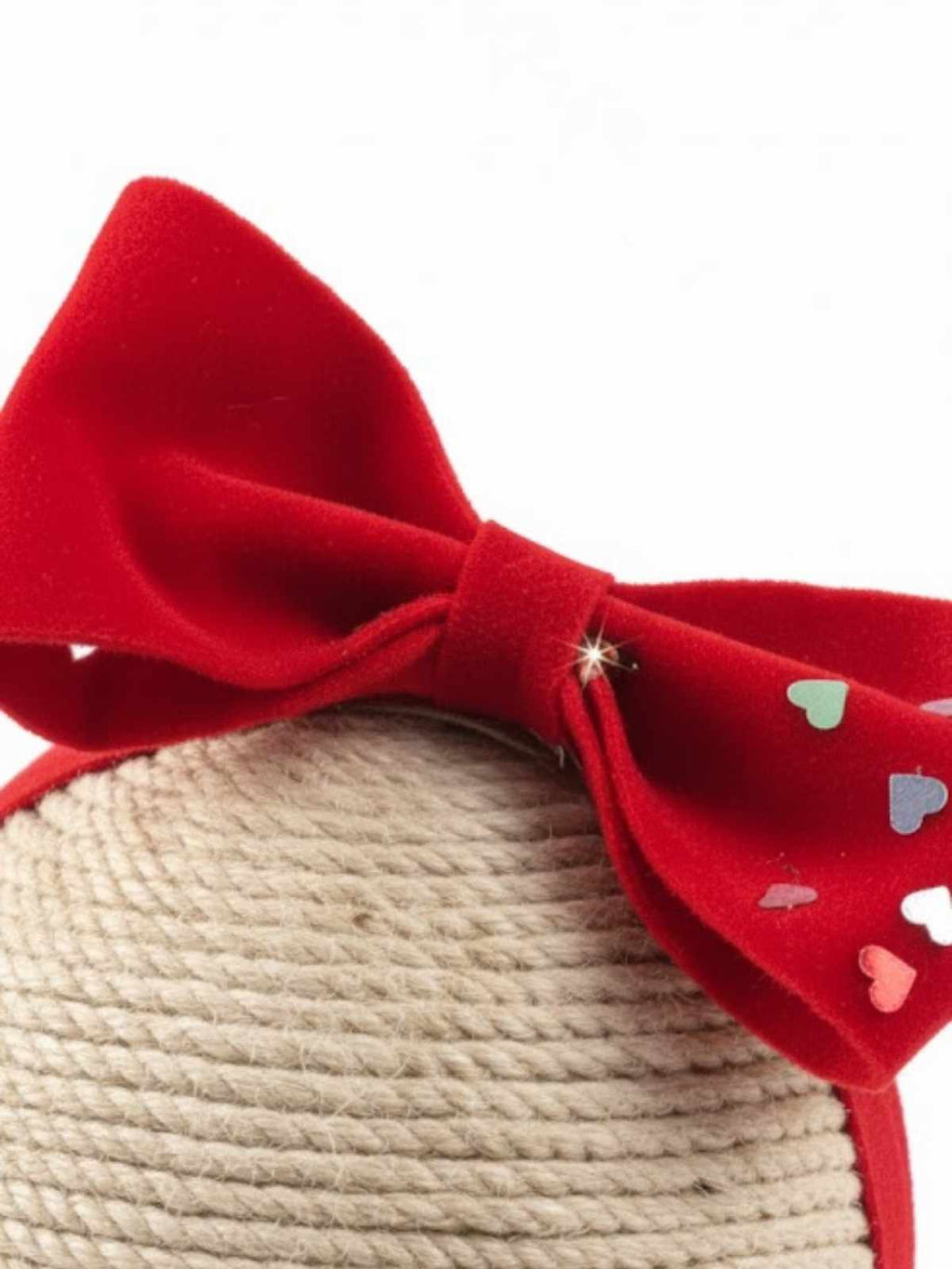 Red bow with heart patterns on a dummy