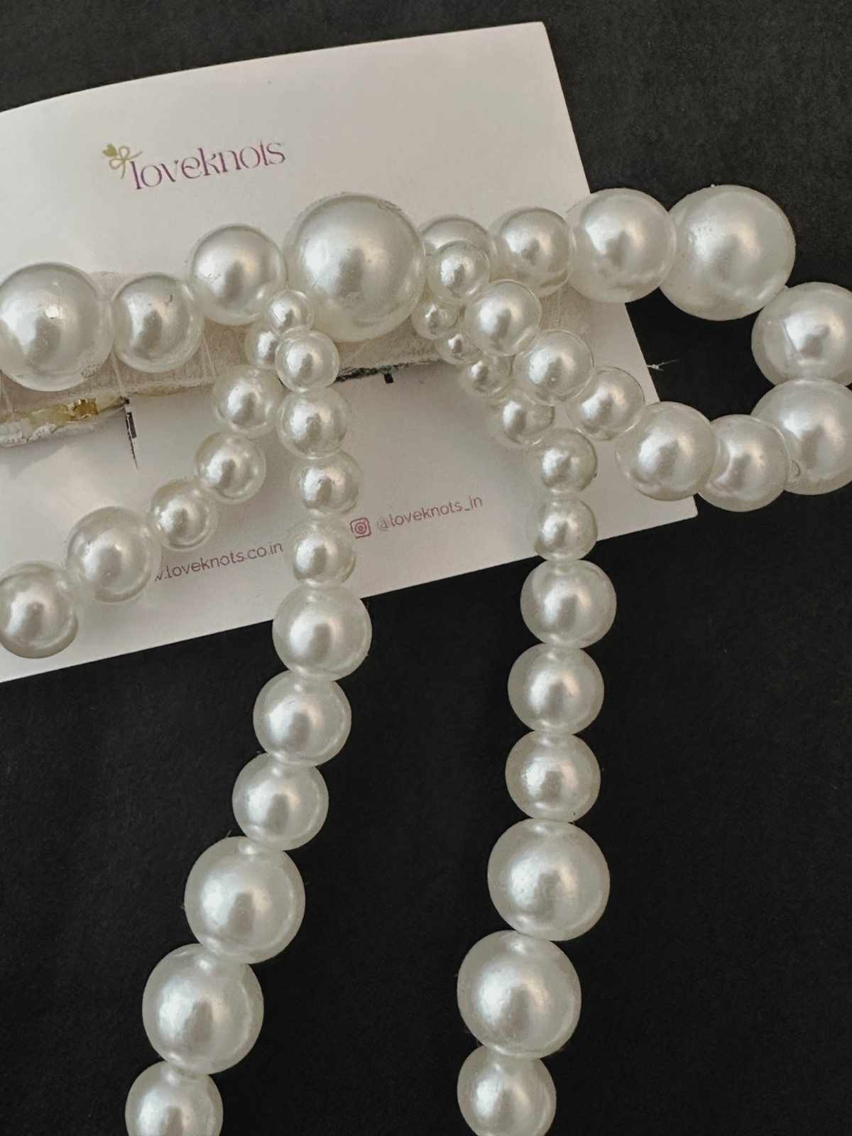 Closeup of pearls bow