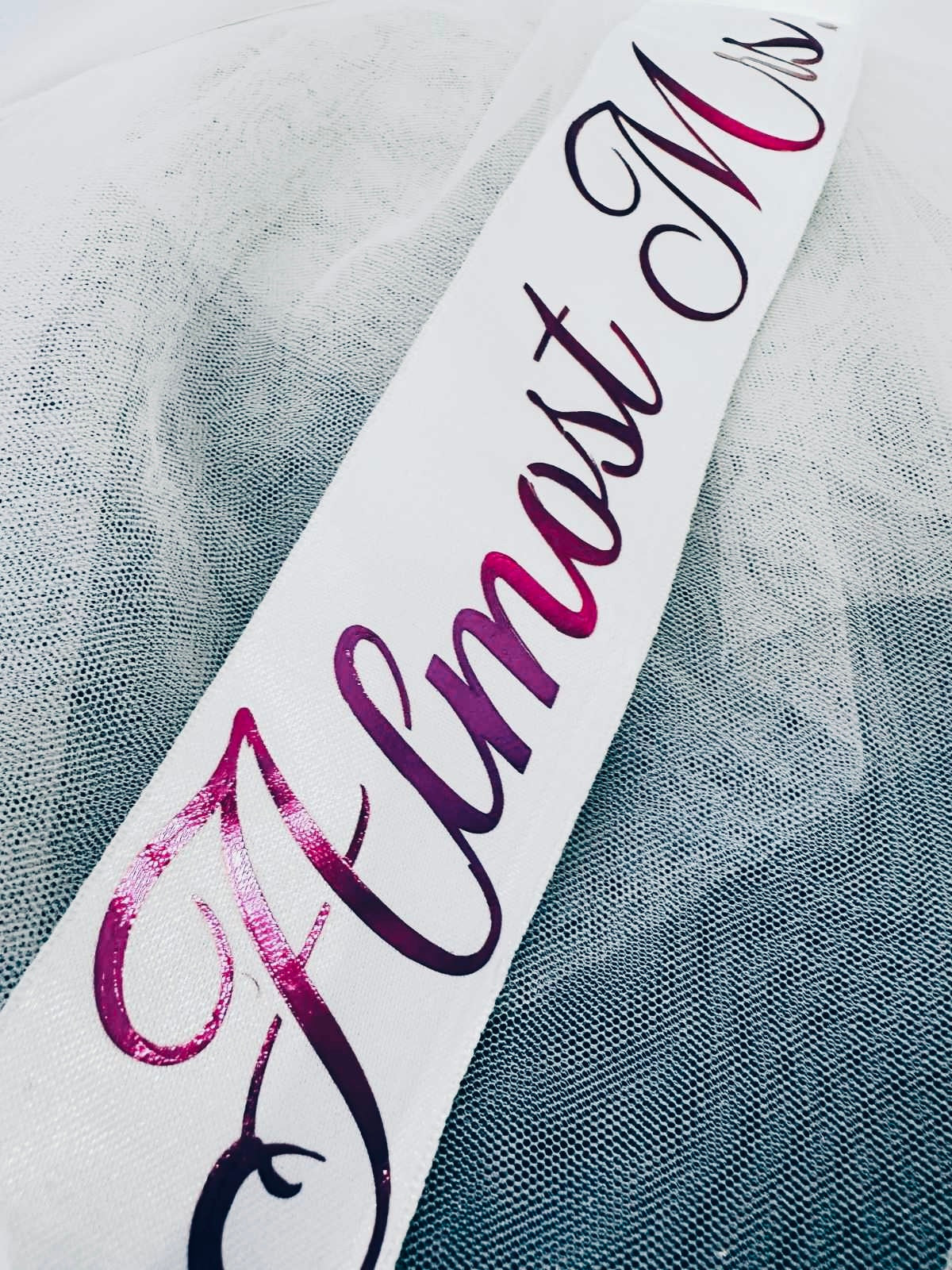 Customised text almost mrs written on bridal veil satin bow