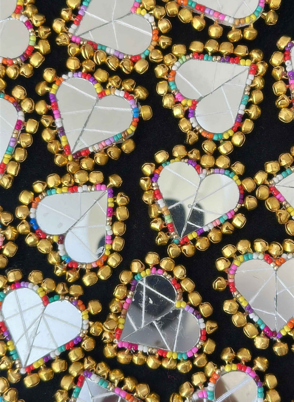 Heart embroidered mirror clips with ghungroos. 