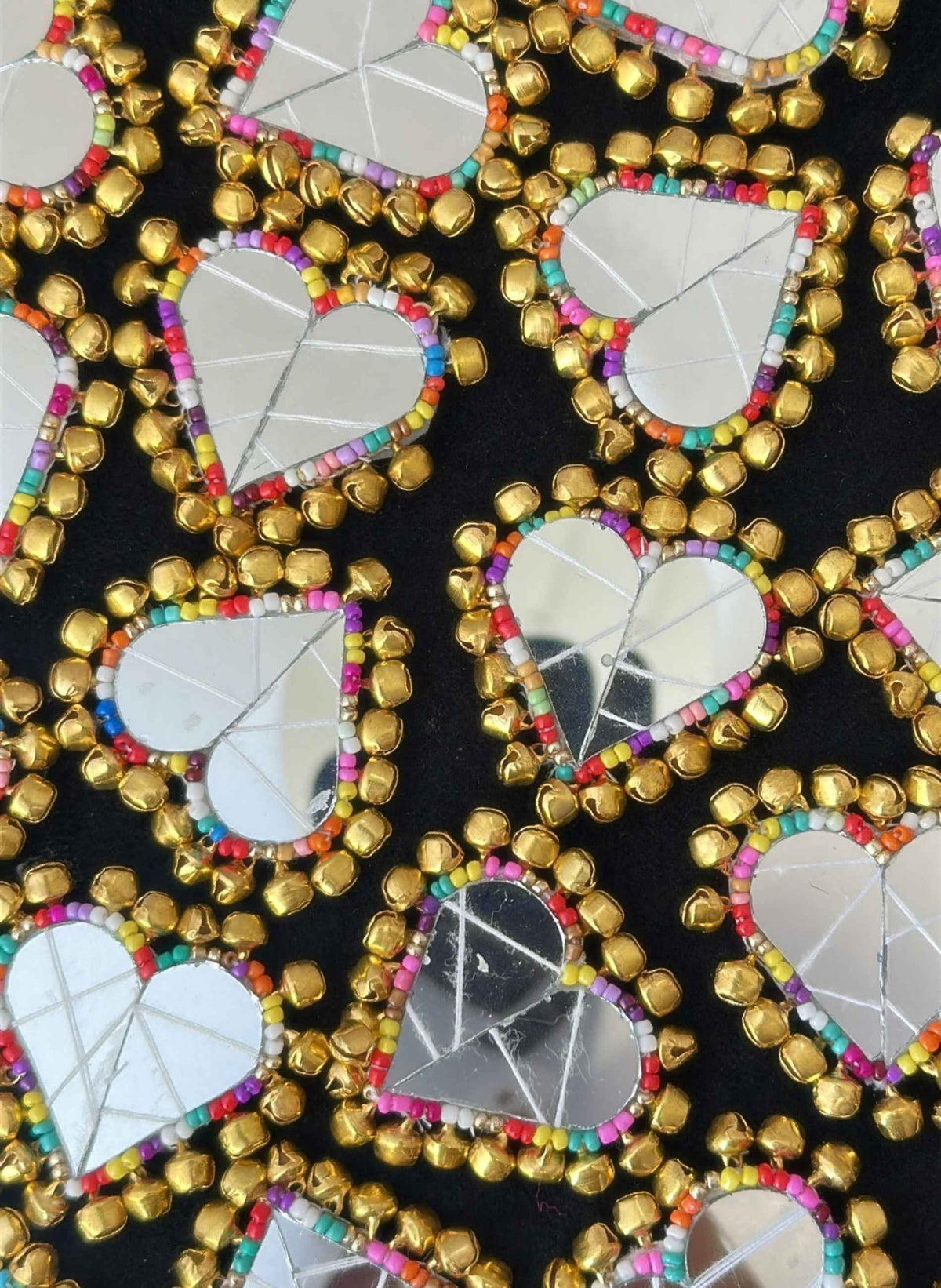 Heart embroidered mirror clips with ghungroos. 