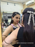 Celebrity Kanica Maheshwari trying on a hair accessory celeste bow by loveknots in front of a mirror