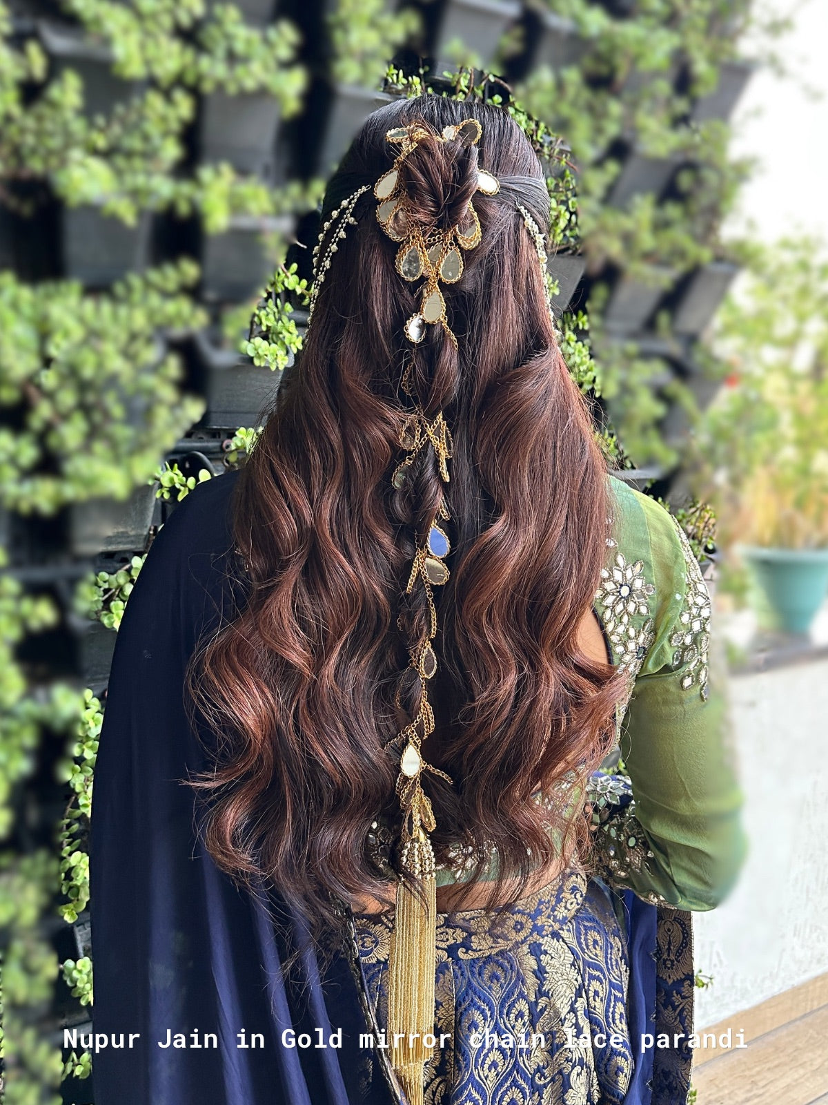 Nupur jain with mirror chain lace hair parandi and traditional attire in a garden setting
