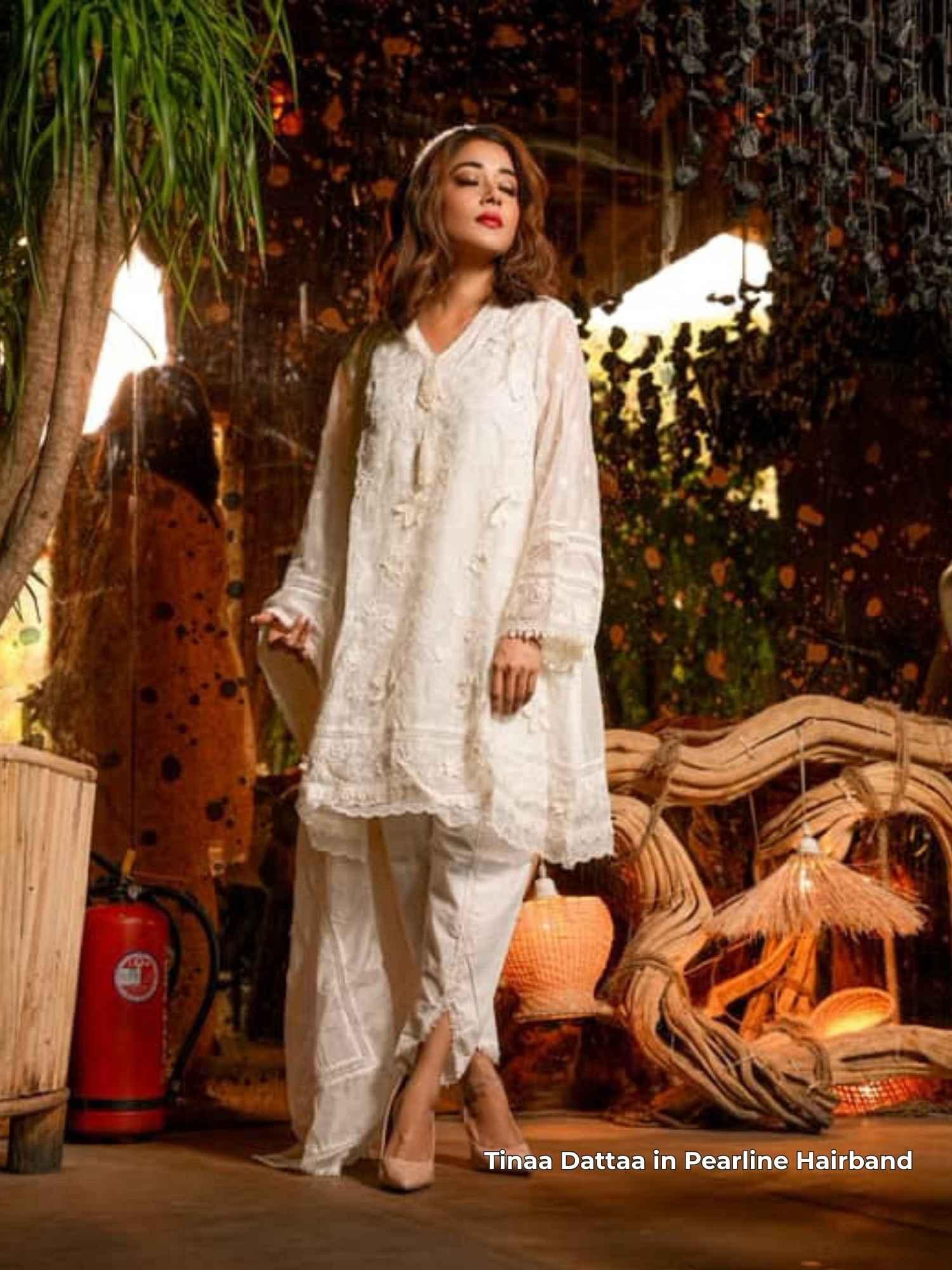 Tinaa Datta  in a white traditional outfit standing with Pearline hairband by loveknots