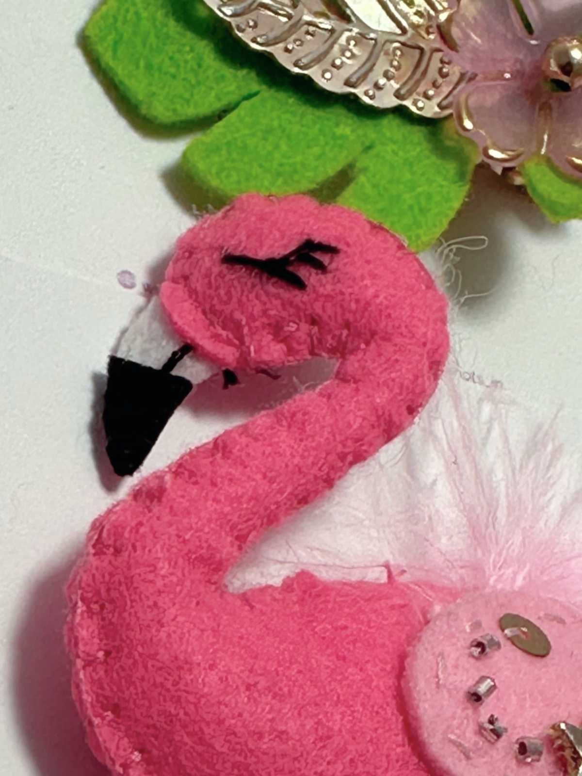 closeup of Pink flamingo hair clip set with embellished wings by loveknots 