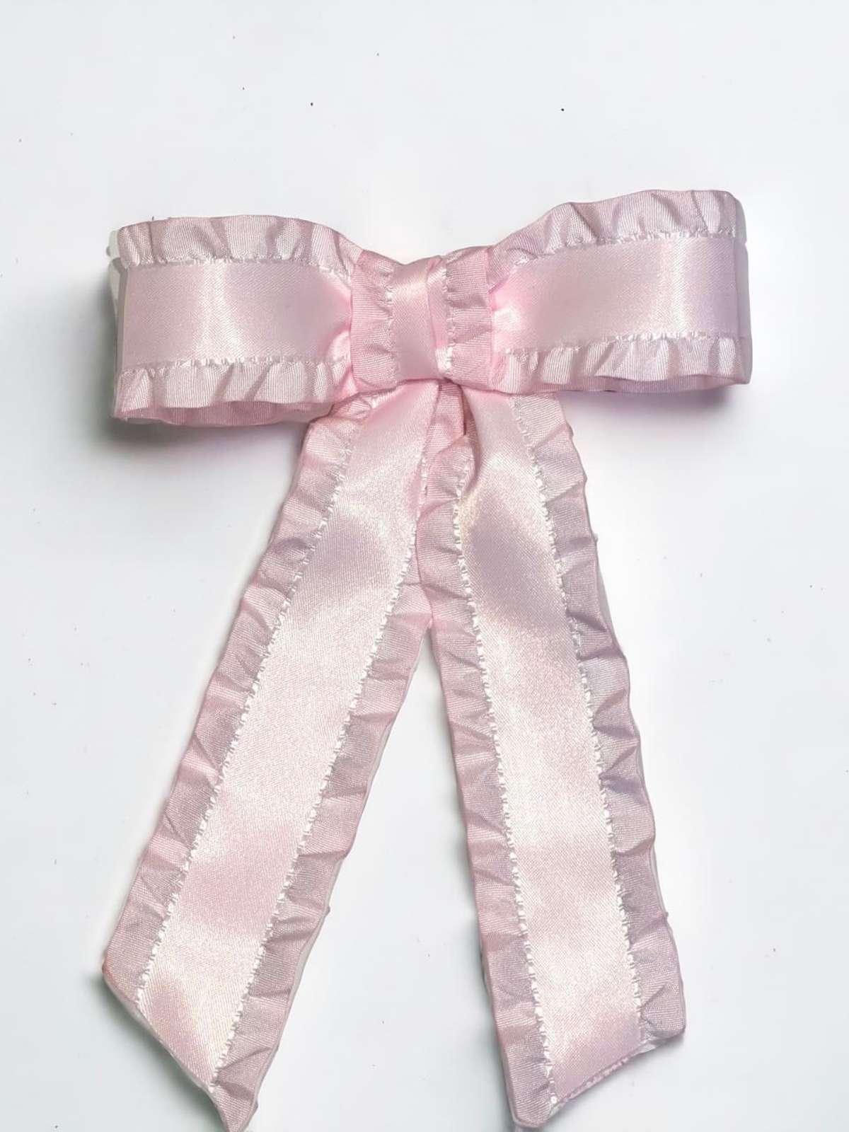 flatlay of blush silkfringe bow by loveknots