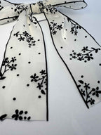 shimmery organza gardenia bow with black stones