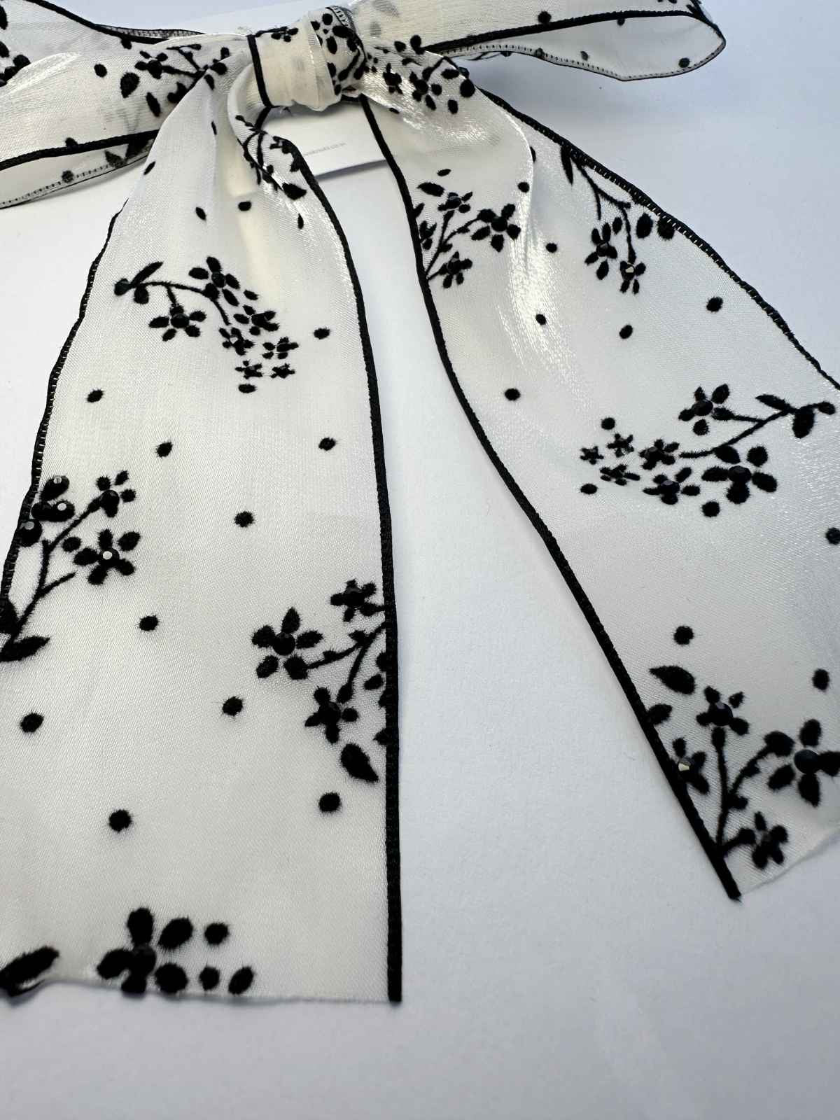 shimmery organza gardenia bow with black stones