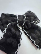 detail of black scalloped cheer bow by loveknots