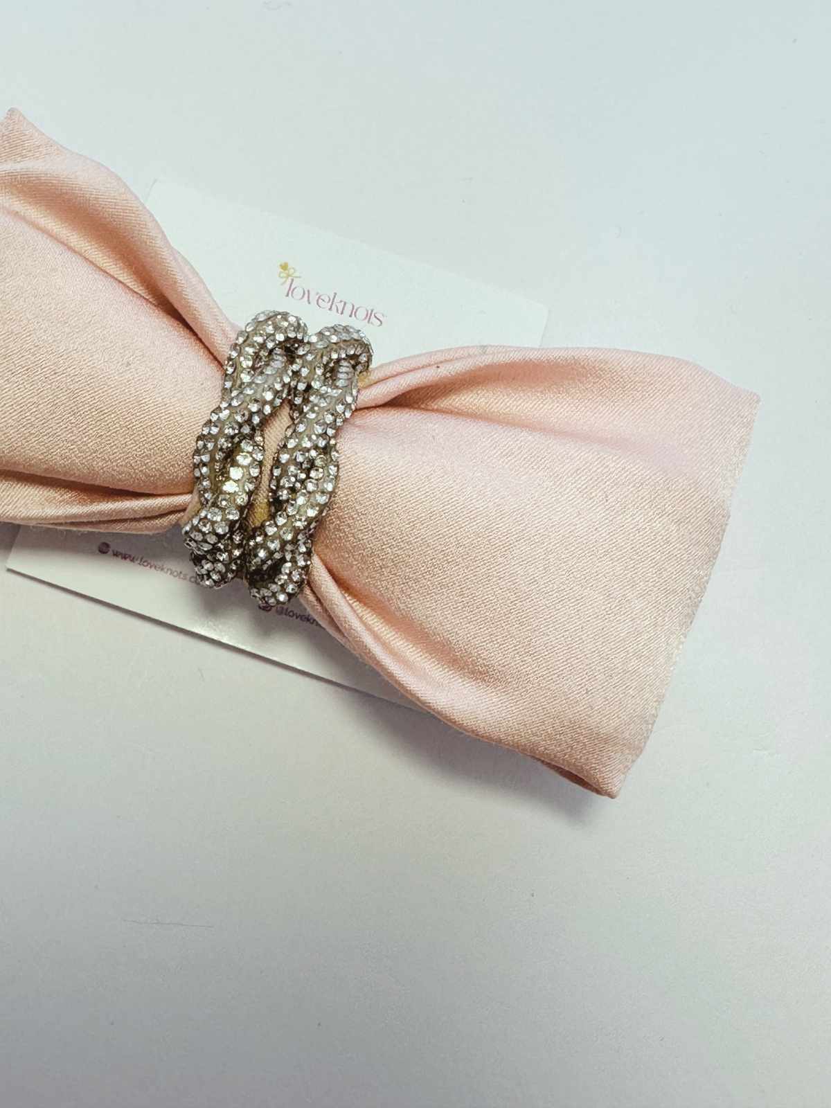 blush pink bow with twisted crystal rope in centre handmade bow by loveknots
