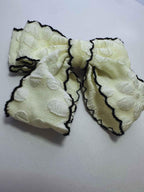 white scalloped cheer bow by loveknots