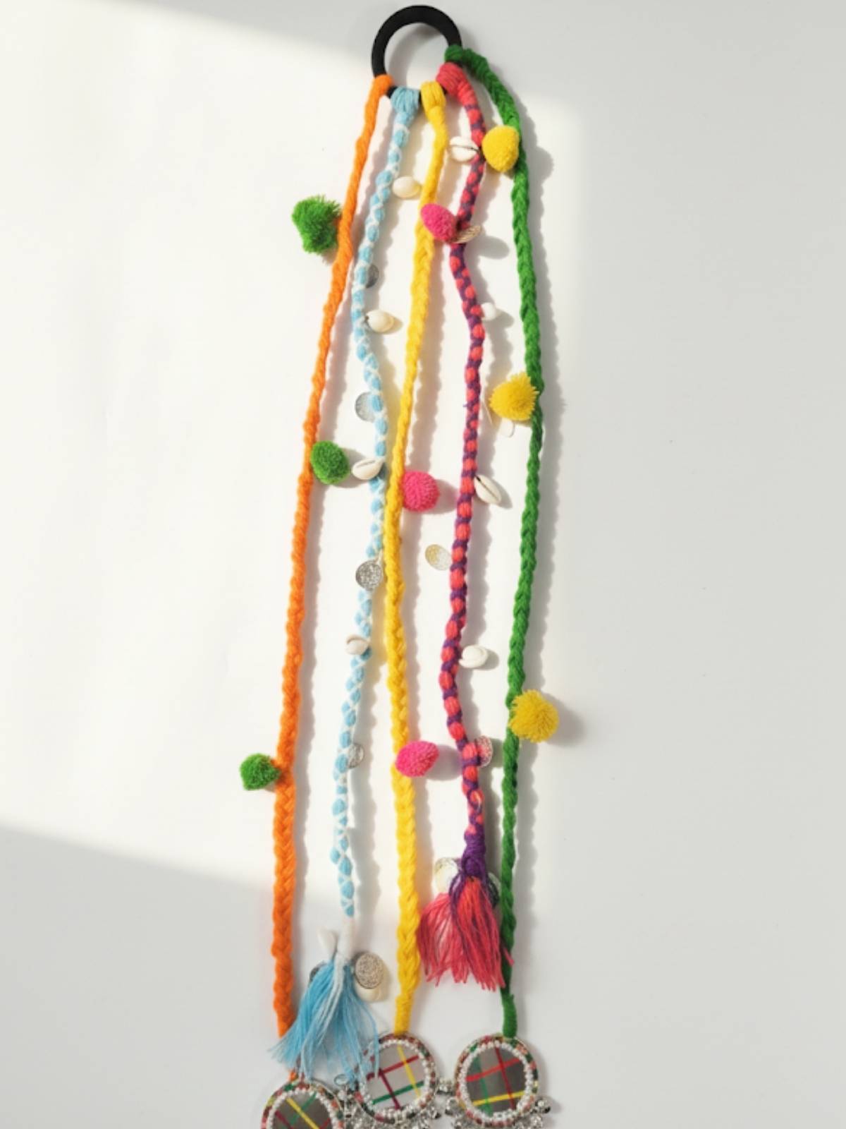 Navratri dandiya prandi with colourful strings and shells