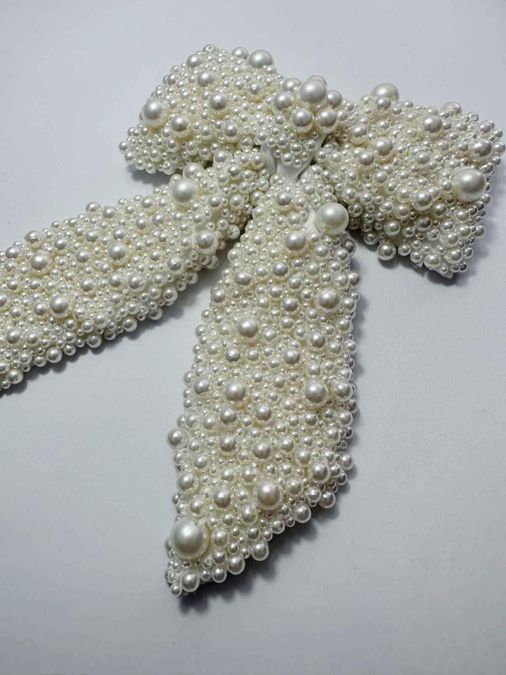 hair bow with pearls on a white background