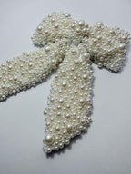 hair bow with pearls on a white background