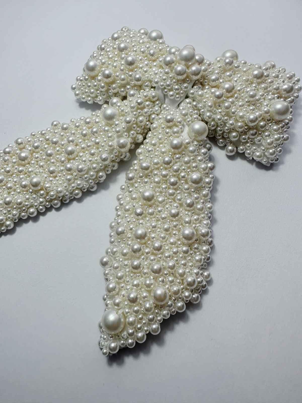 hair bow with pearls on a white background