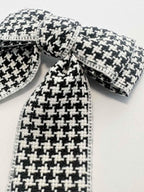 closeup of houndstooth bow