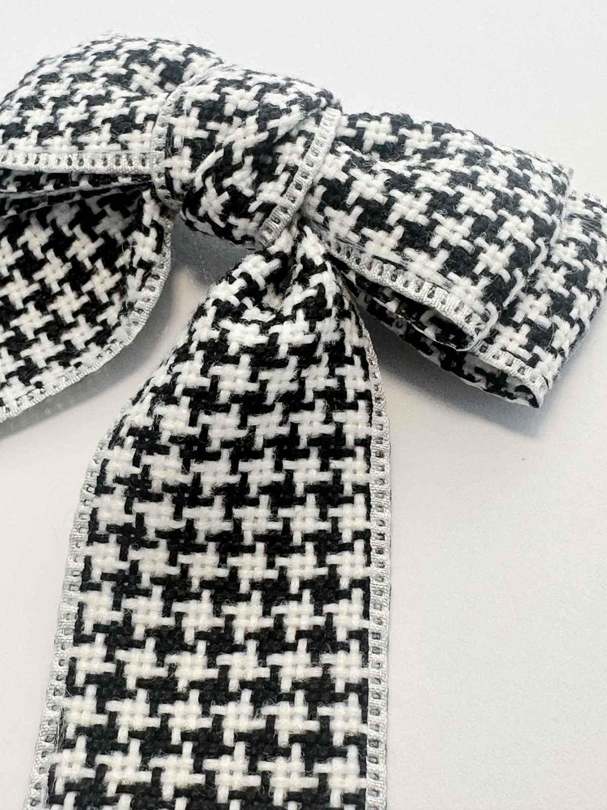 closeup of houndstooth bow