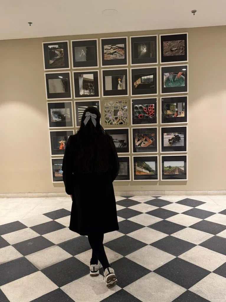 women standing in front of a art gallery wall with loveknots check houndstooth bow