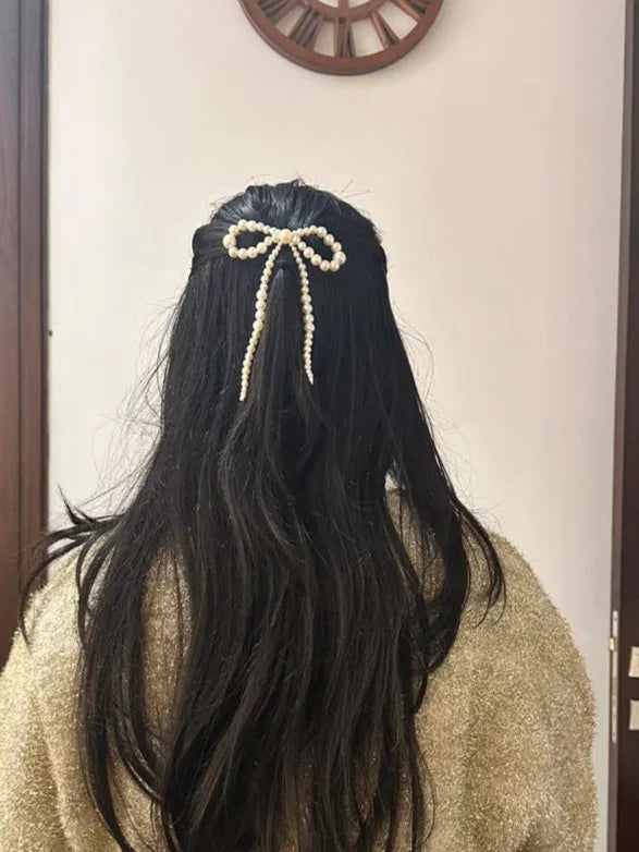 women with long hair wearing a pearl bow by loveknots